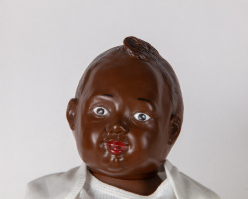 Close up of African American Nancy Newborn doll.