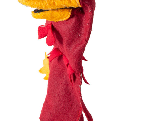 Side view of cocky hand puppet. Red and yellow felt with white eyes.