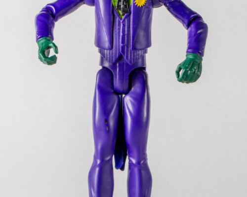 Front view of joker action figure. Purple suit and green shirt.