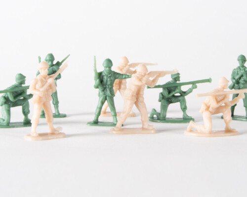 Green and tan army men, posed with rifles, bazookas, and radios.